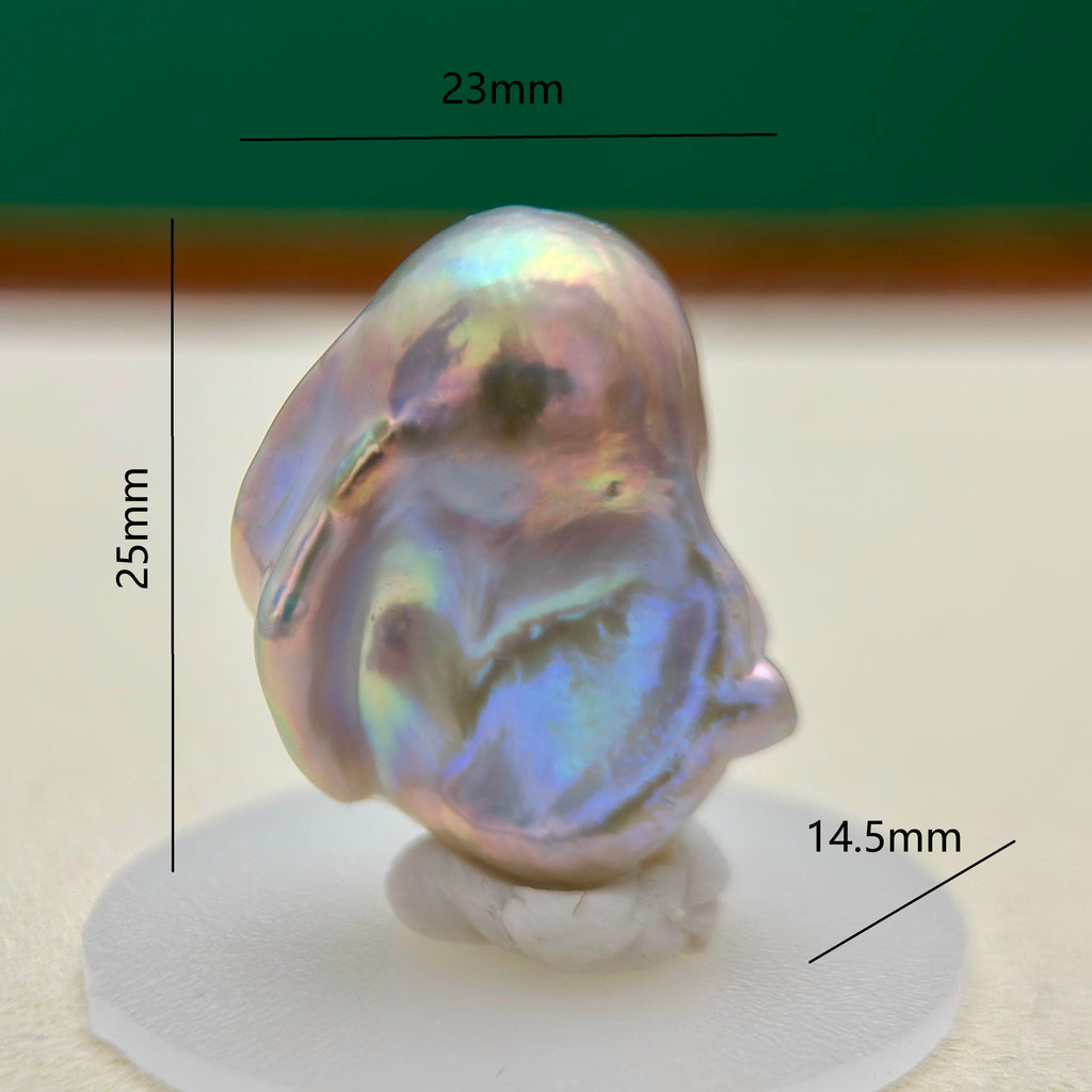 A single iridescent baroque pearl shown on a white display base with overlaid dimension lines and labels reading 25mm, 23mm, and 14.5mm.
