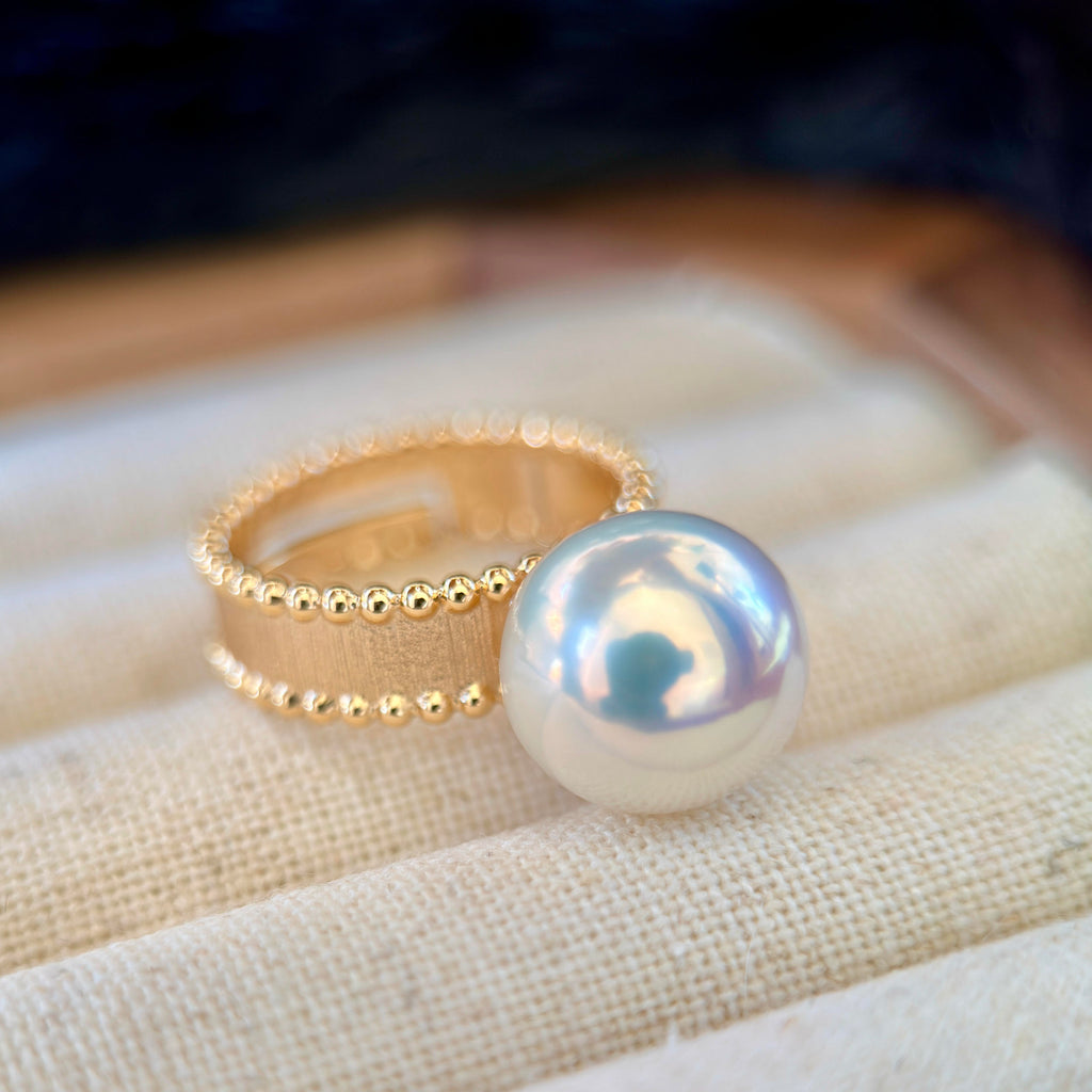 Gem-quality round white freshwater pearl ring.