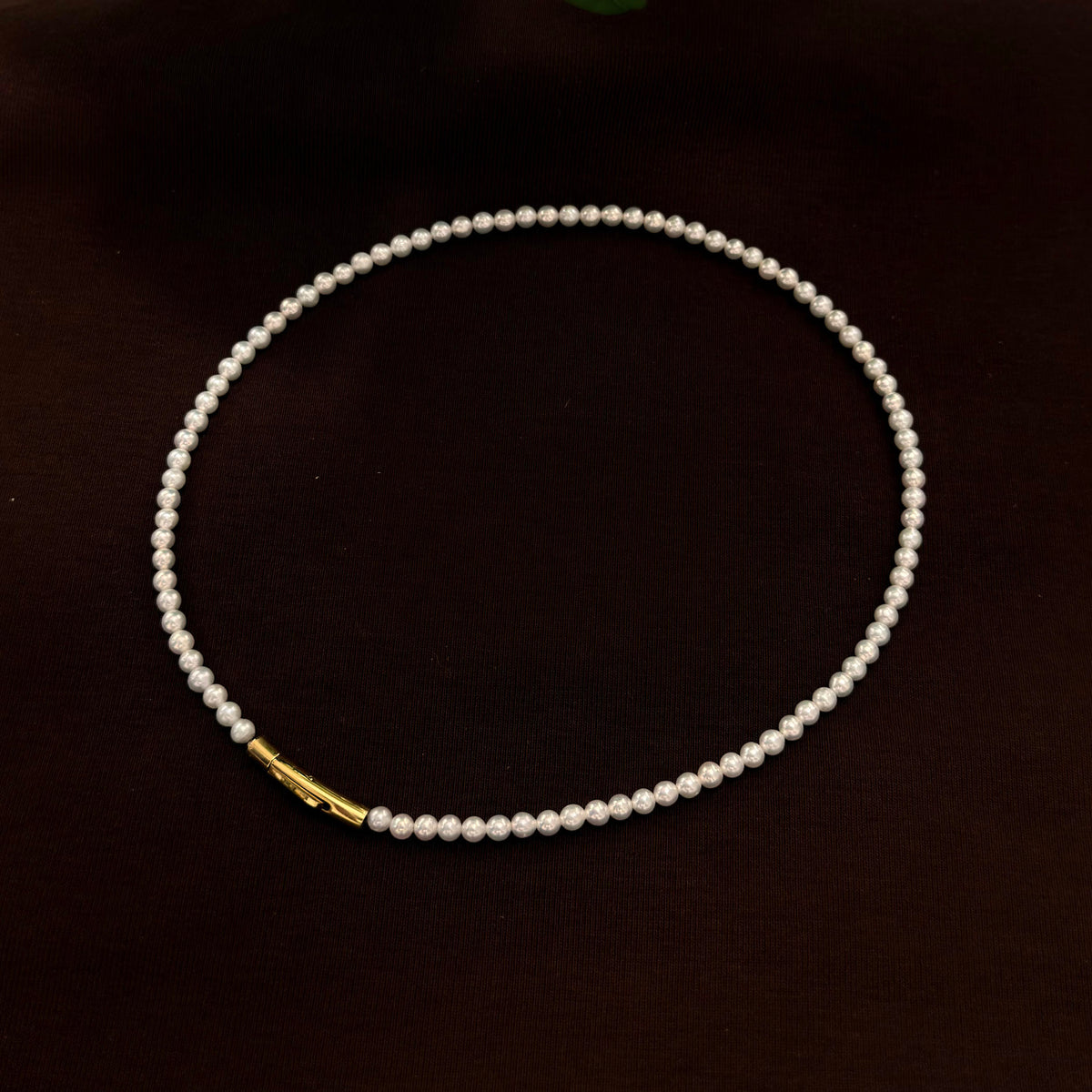 3.5 mm bright white freshwater pearl necklace, 42 cm long.