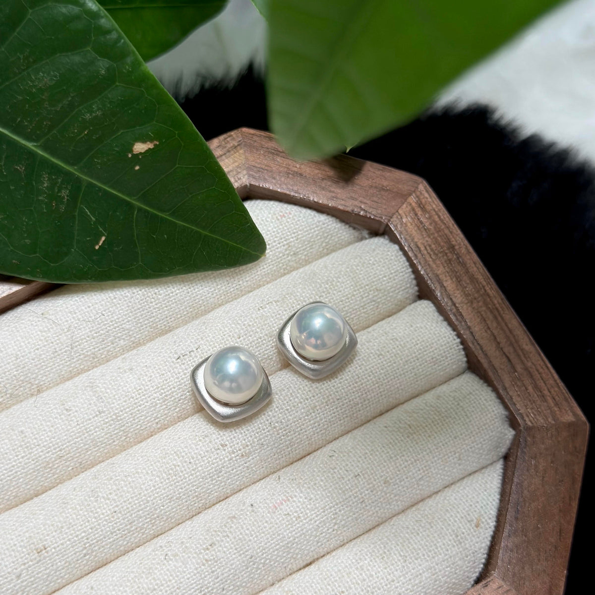 Refined freshwater pearl stud earrings in frosted sterling silver.