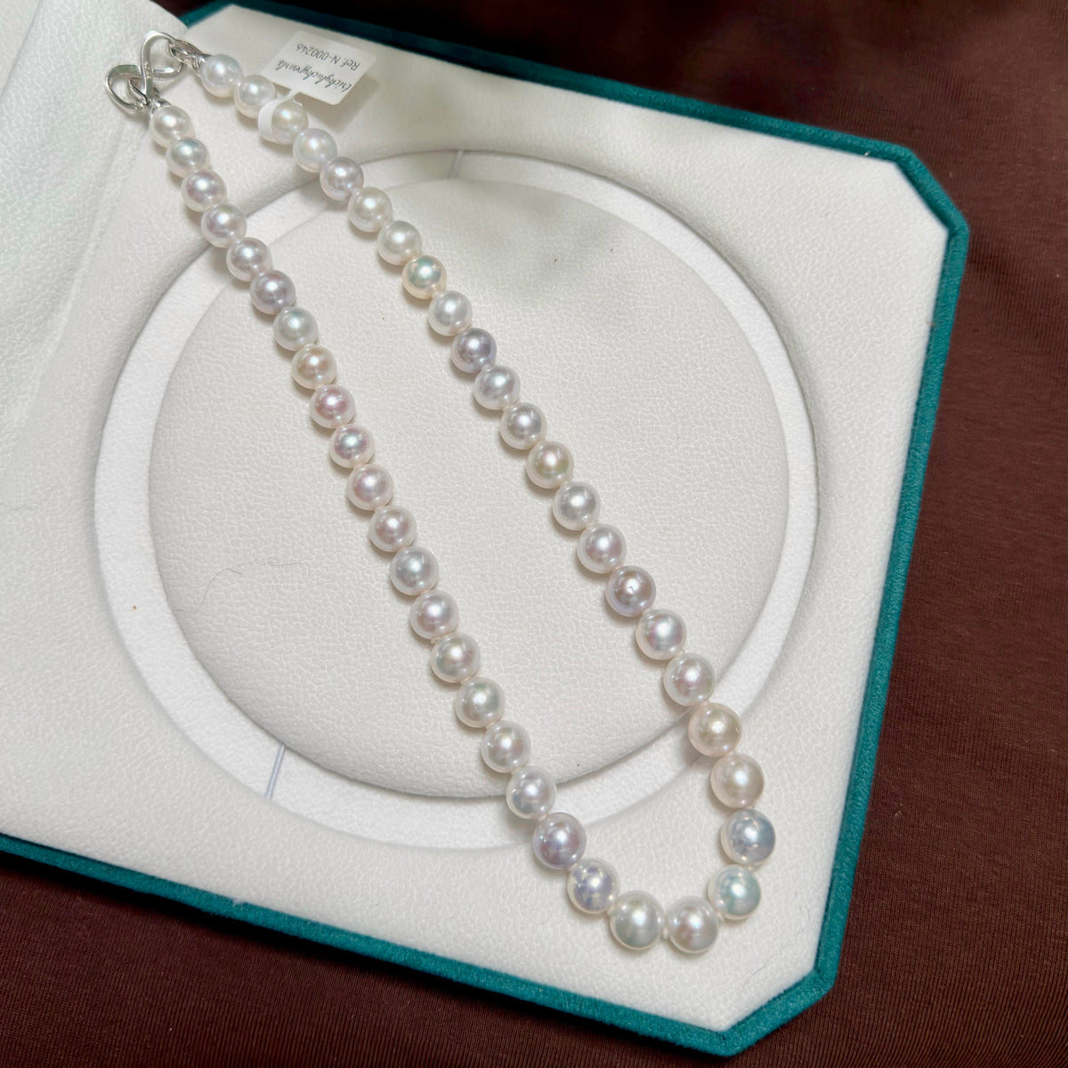Natural freshwater pearls showing high lustre and near-round to round shape.