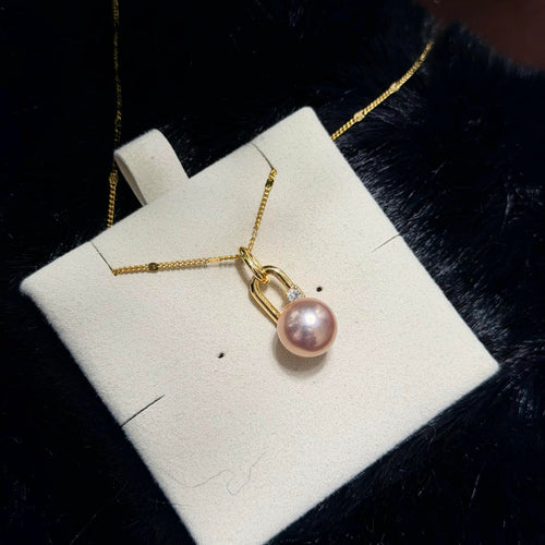 Golden-pink 10.3 mm freshwater pearl pendant with an openable bail.