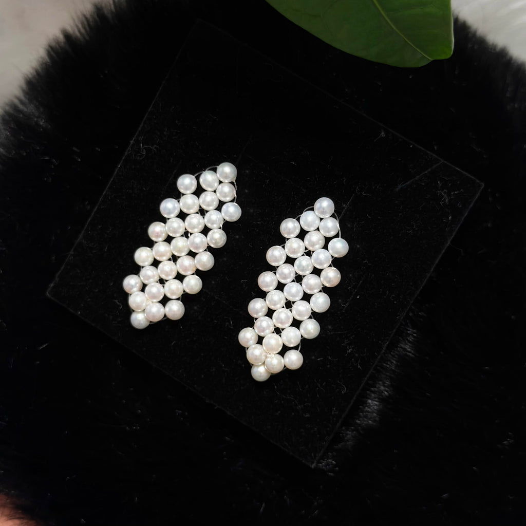 Woven check earrings featuring luminous 4.5 mm white freshwater pearls.