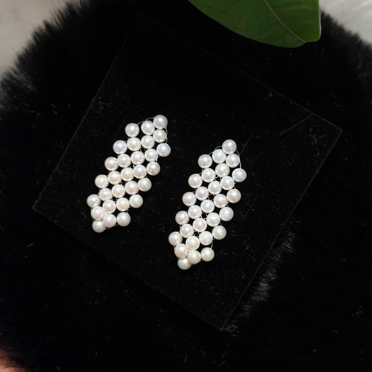 Woven check earrings featuring luminous 4.5 mm white freshwater pearls.