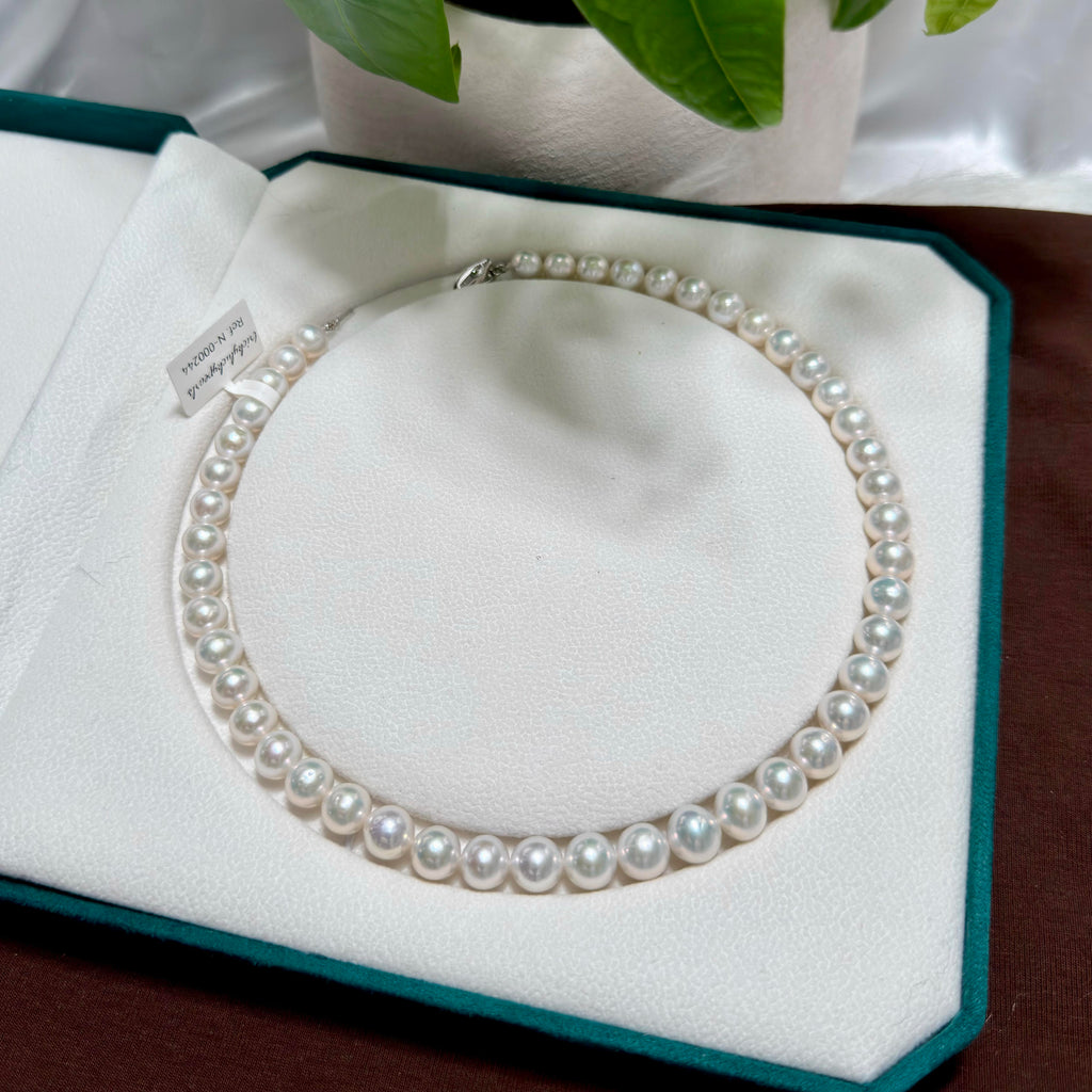 Cool white with silver-blue halo freshwater pearl strand with 10 mm pearls.