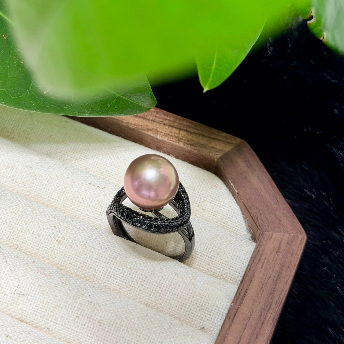 Unique brown pearl ring with luminous golden halo.