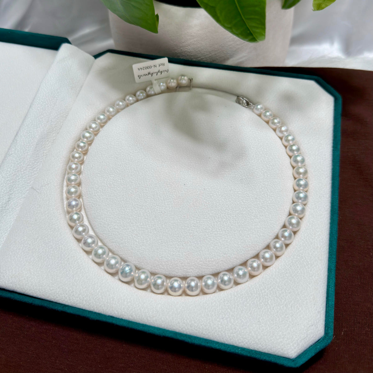 10 mm cool white with silver-blue halo freshwater pearl necklace, 42 cm long.