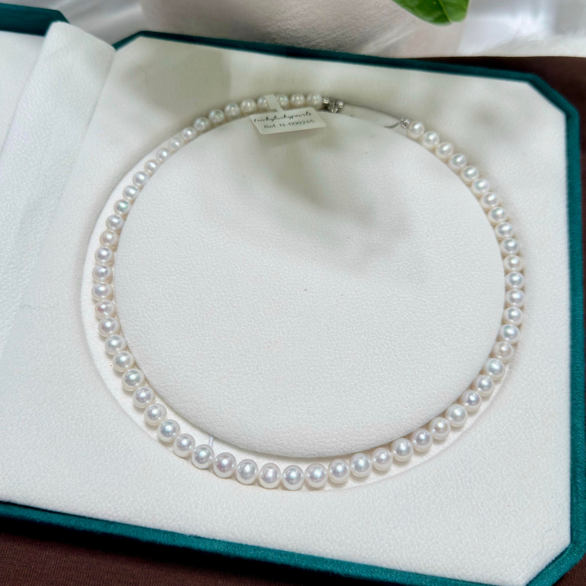 Cool white with vivid blue iridescence freshwater pearl strand with 7 mm pearls.