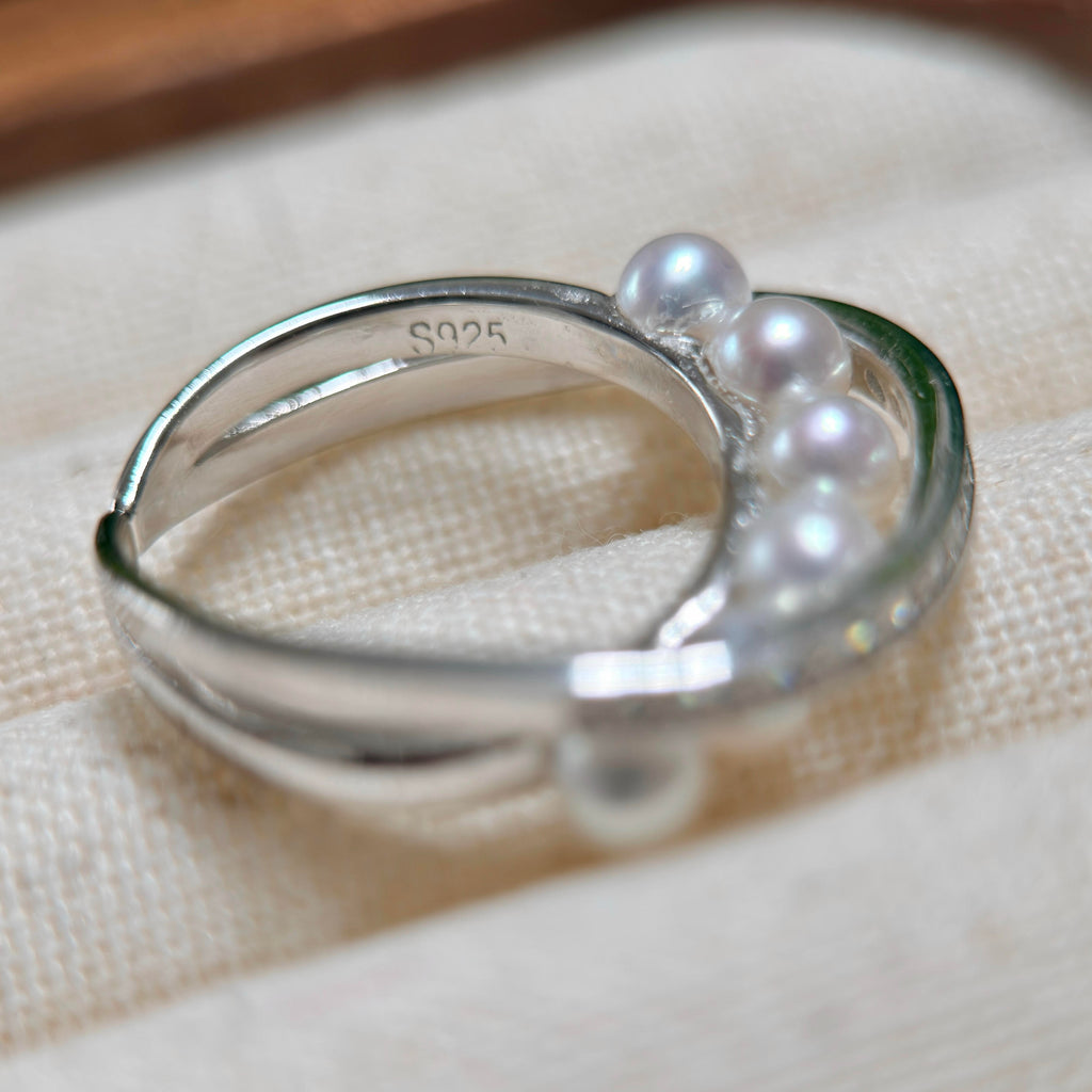 Adjustable silver open ring with bright white freshwater pearls.