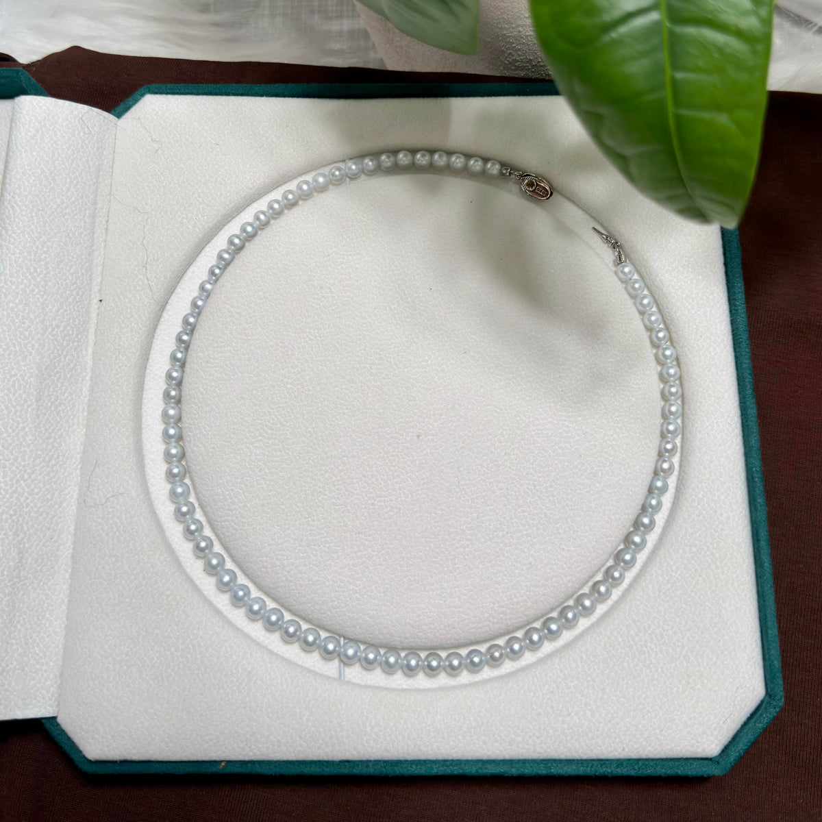Small round freshwater pearl strand finished with a silver clasp.