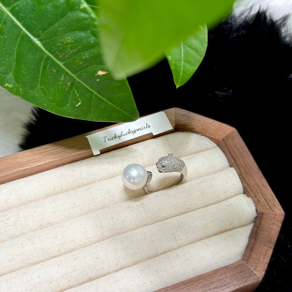 Animal-inspired pearl ring with polished sterling silver setting.