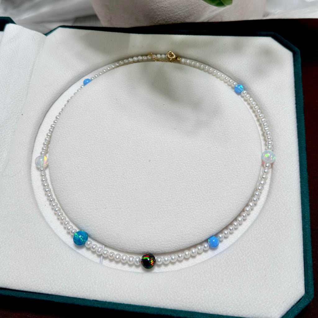 4.5 mm luminous white freshwater pearls paired with colourful opals.