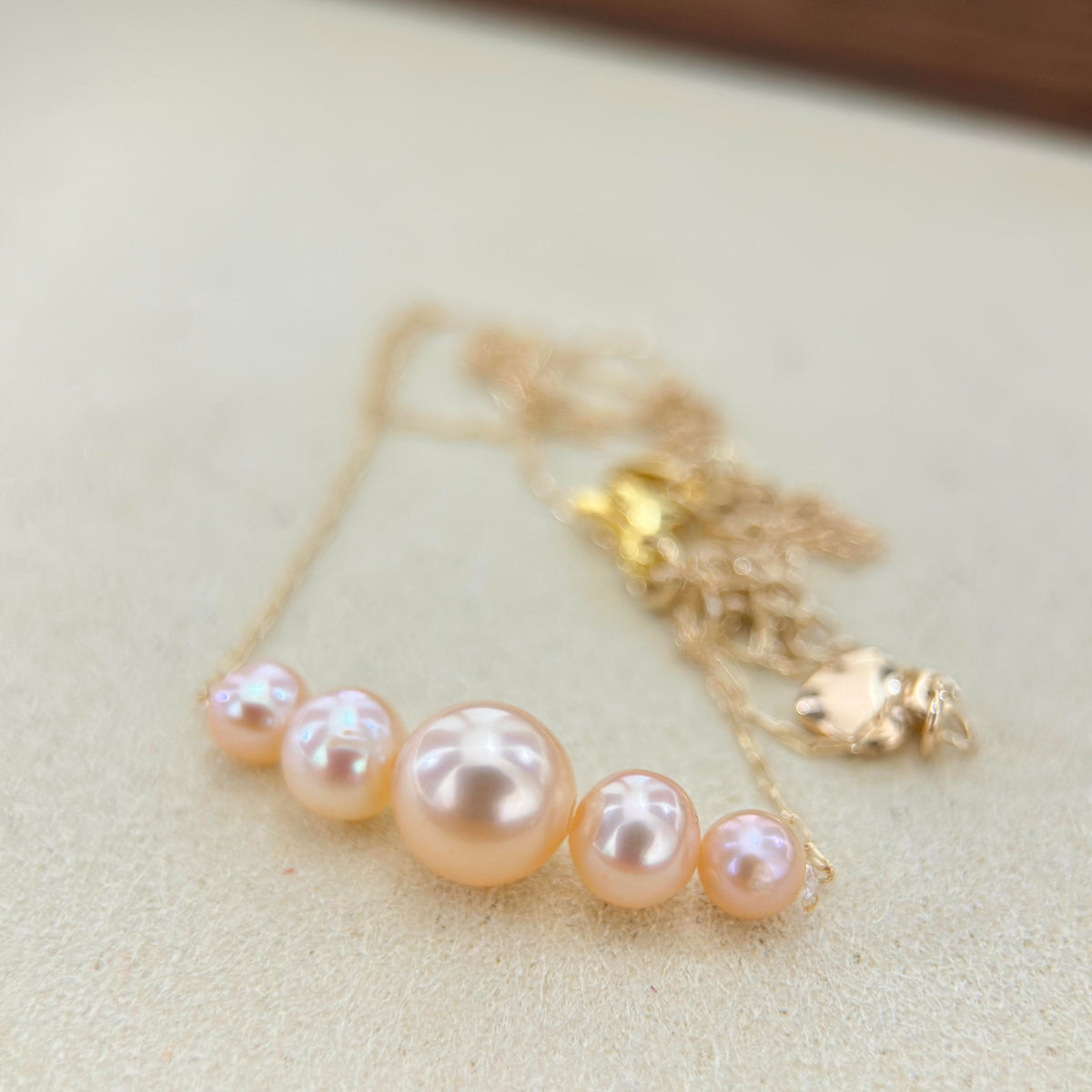 Gradient pearl necklace styled for a romantic date-night look..