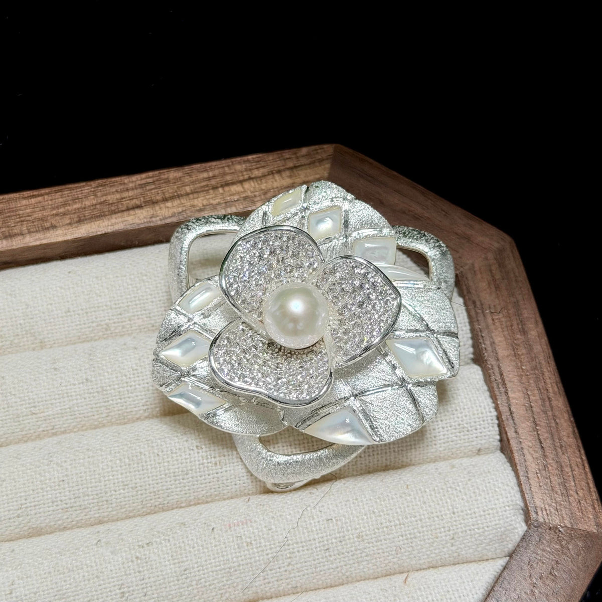Cool white freshwater pearl brooch with a refined floral statement look.