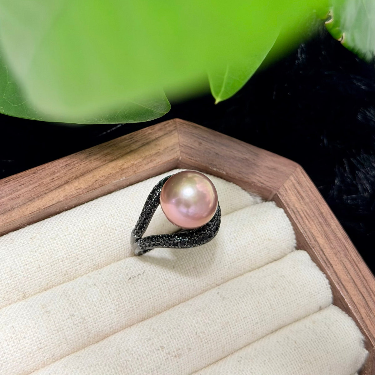 Dramatic pearl ring surrounded by black zircon stones.