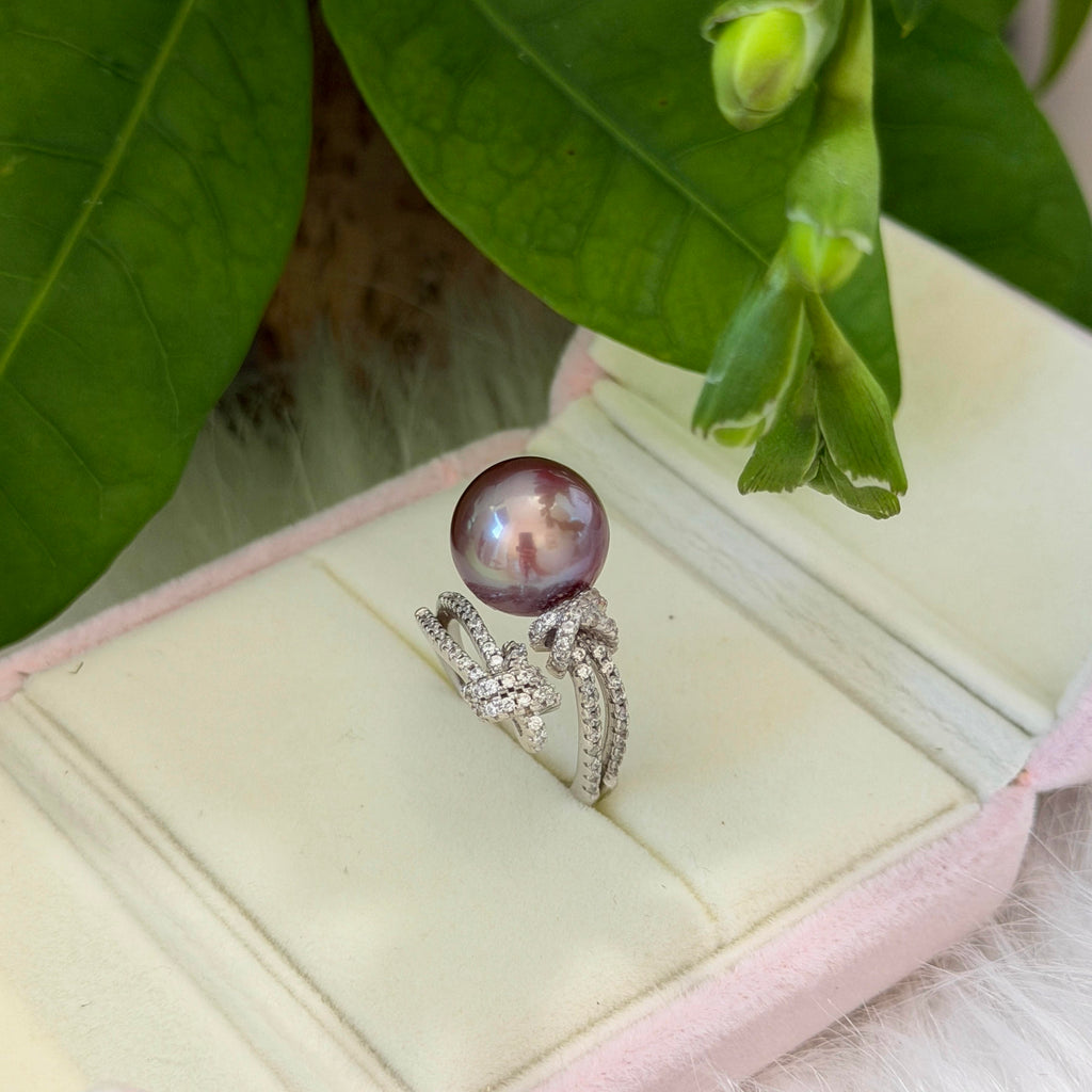 Deep purple pearl ring with a cool blue halo in sterling silver.
