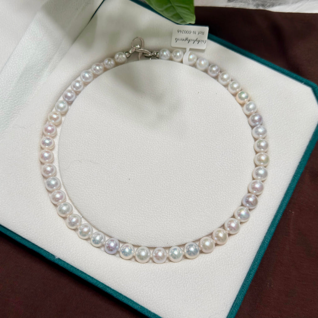 White with vivid blue and multicolour halo freshwater pearl strand with 9–10 mm pearls.