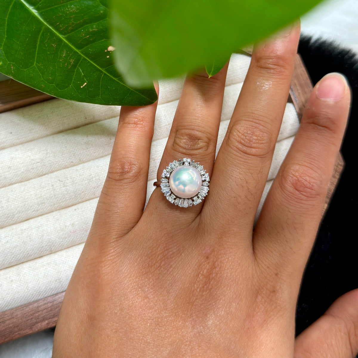 White pearl displaying cool blue iridescent overtones.