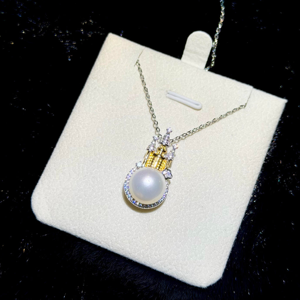 Princess-inspired sterling silver necklace with sparkling castle details and white pearl.