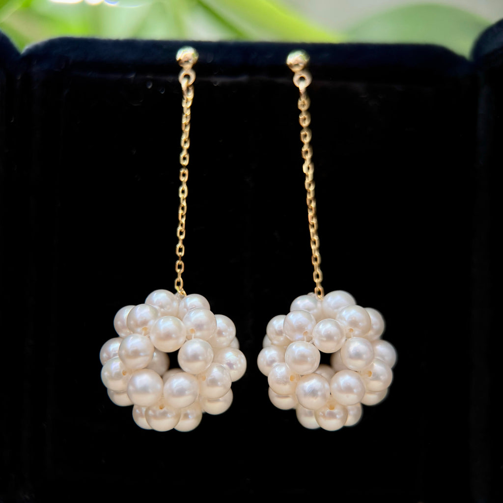 Hydrangea-inspired drop earrings made with luminous white freshwater pearls.

