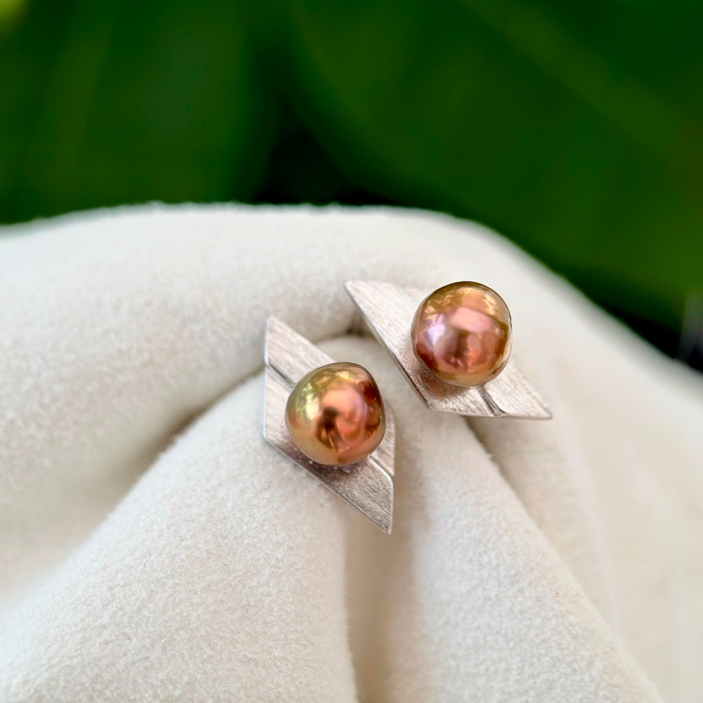 Contemporary baroque pearl earrings with an architectural design.