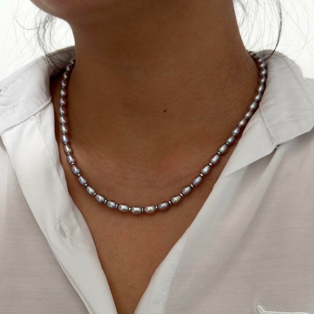 Detailed view of high-lustre purple freshwater pearls.