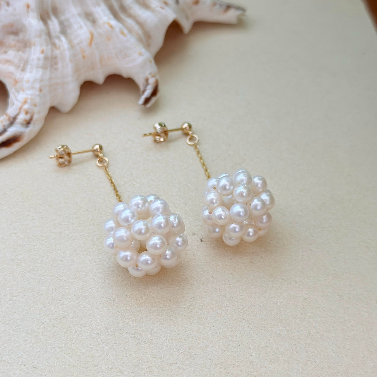 White freshwater pearl flower earrings with sterling silver settings.
