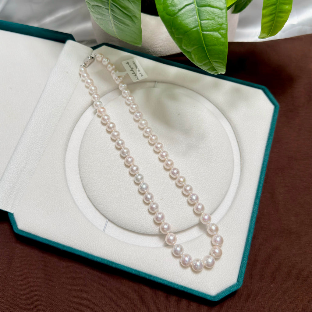 White freshwater pearl strand featuring luminous pink overtones.
