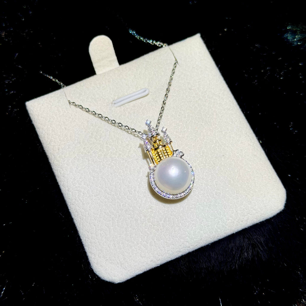 Two-tone silver and gold castle pendant with a luminous freshwater pearl.