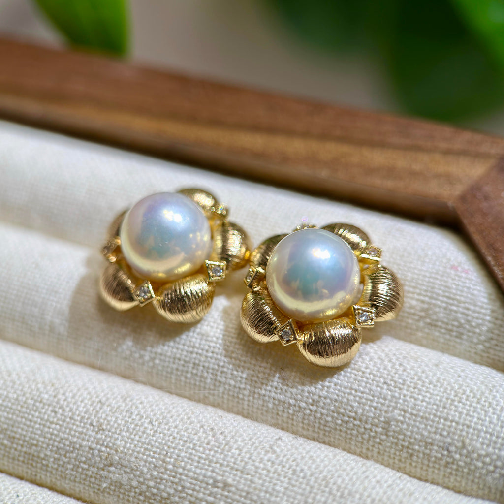 Statement 10 mm white pearl earrings with vintage flower design.