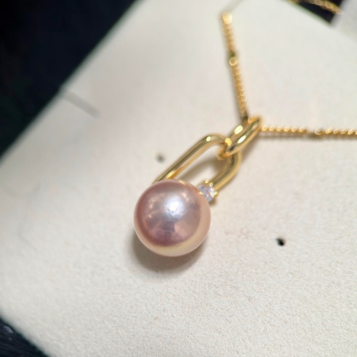 High-lustre freshwater pearl pendant styled for a romantic date night.