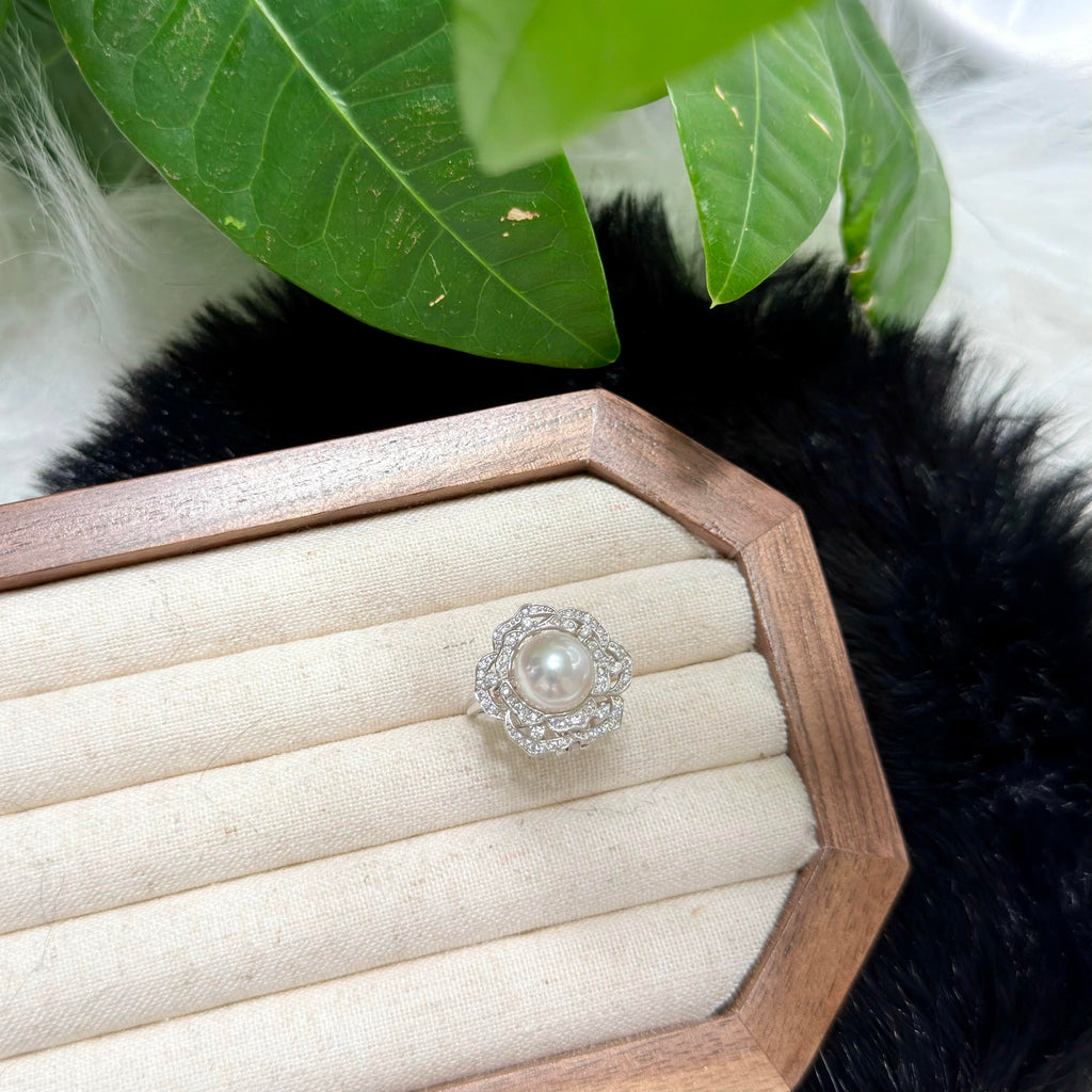 Adjustable sterling silver pearl flower ring for elegant everyday styling.