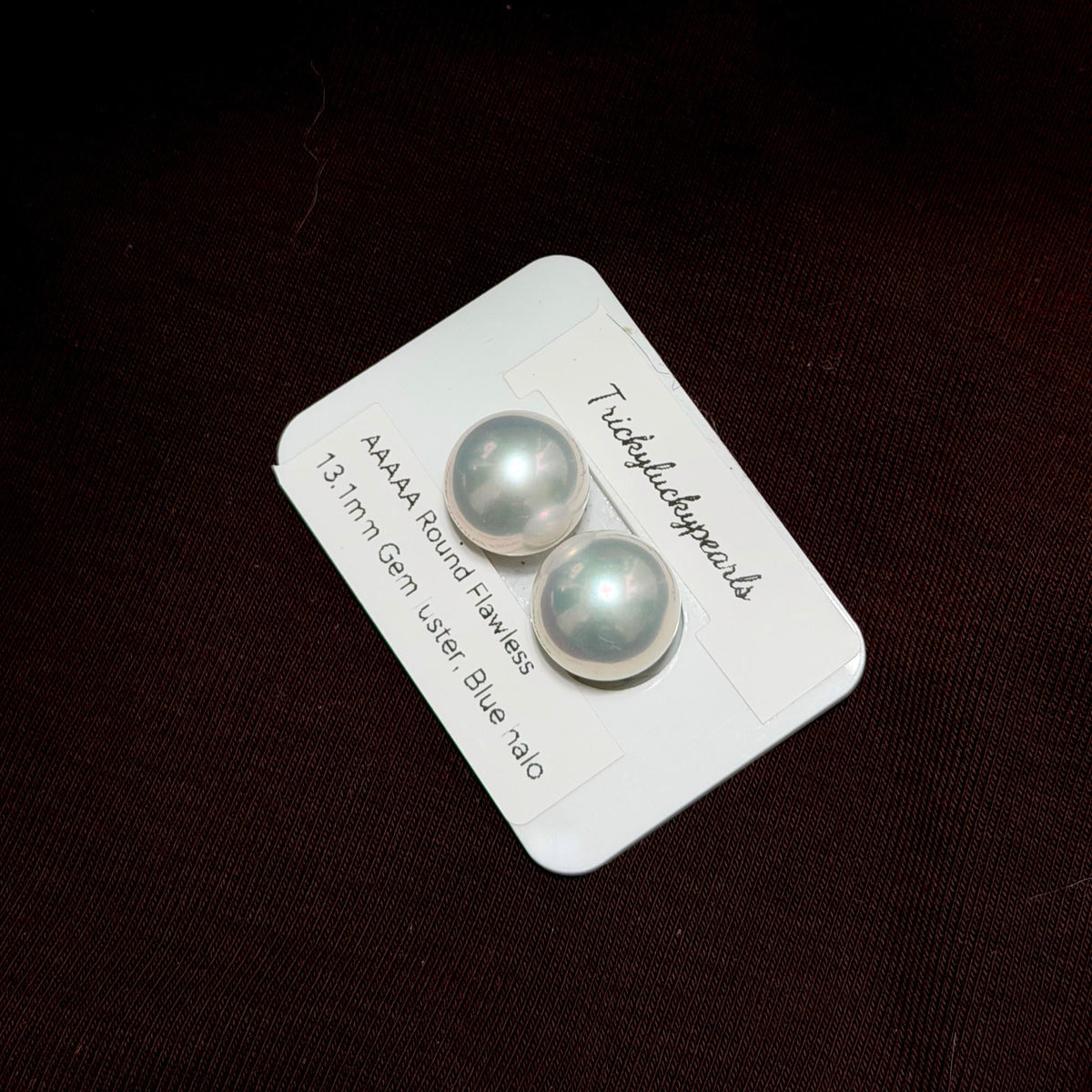 Large white freshwater pearl earrings with exceptionally strong lustre.