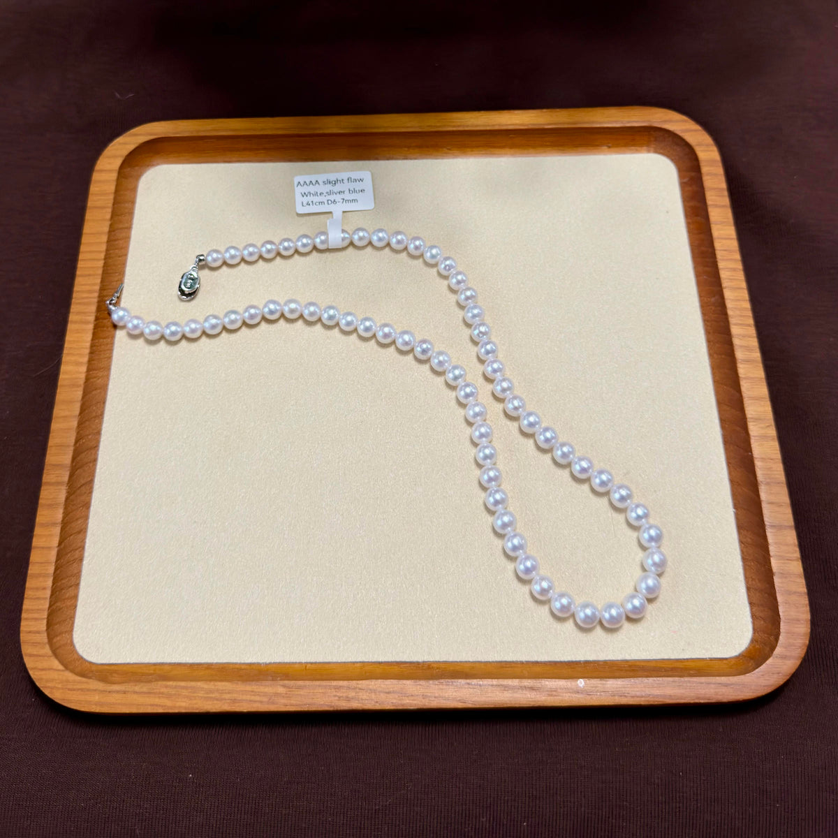 Natural freshwater pearls showing high lustre and round / slight natural surface marks shape.
