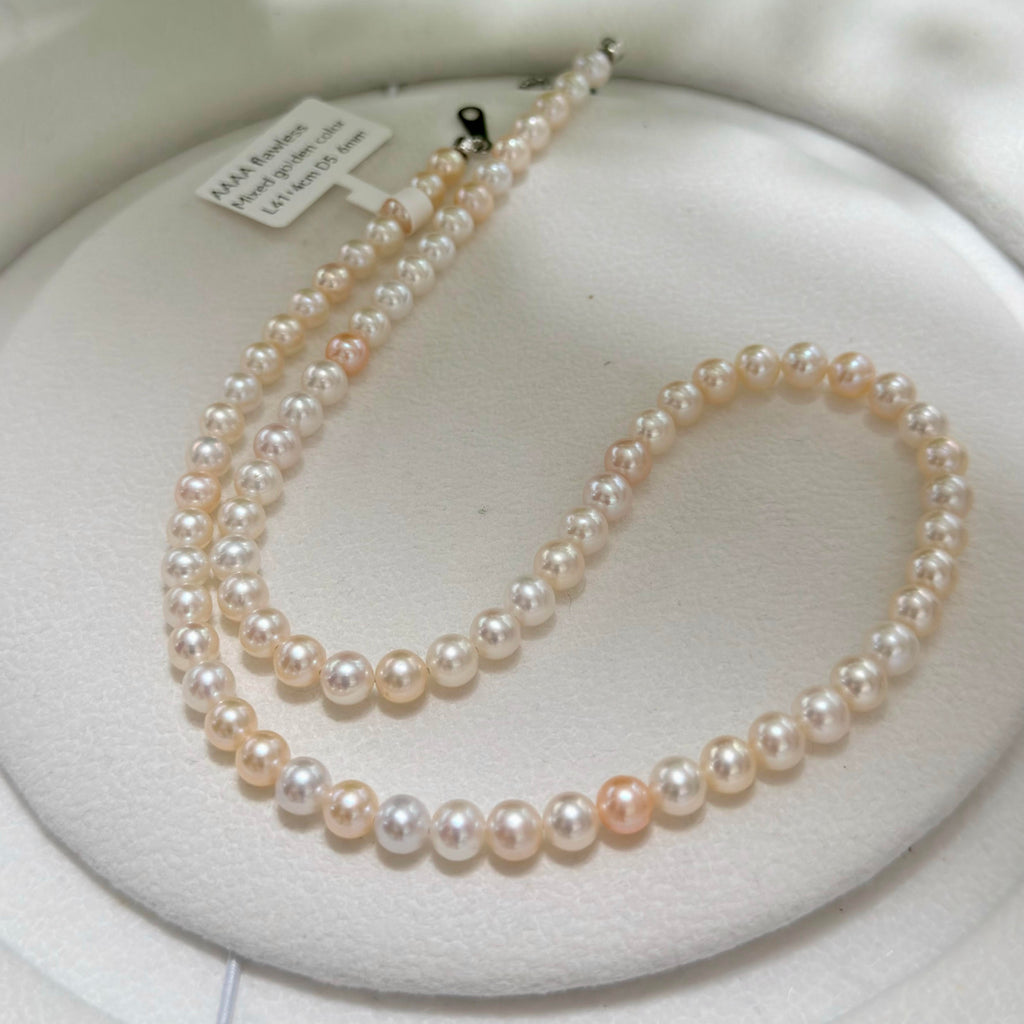 Natural pearl necklace showing subtle individual pearl variation.