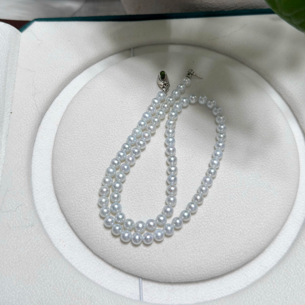 5.5–6 mm natural freshwater pearls arranged in a refined single-strand necklace.