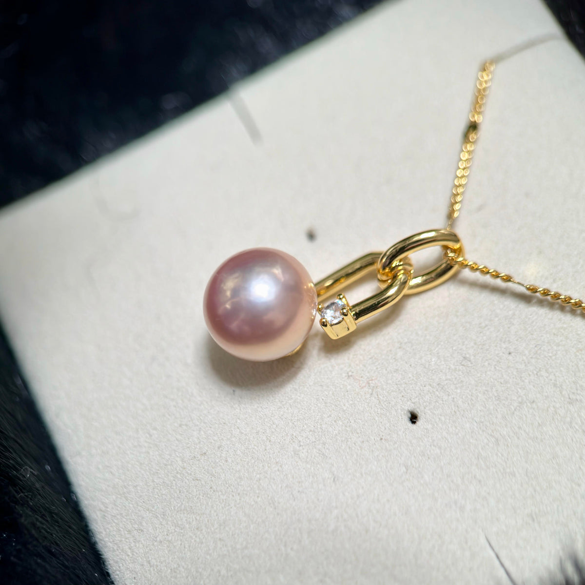 Openable bail pearl pendant designed for styling with compatible chains.