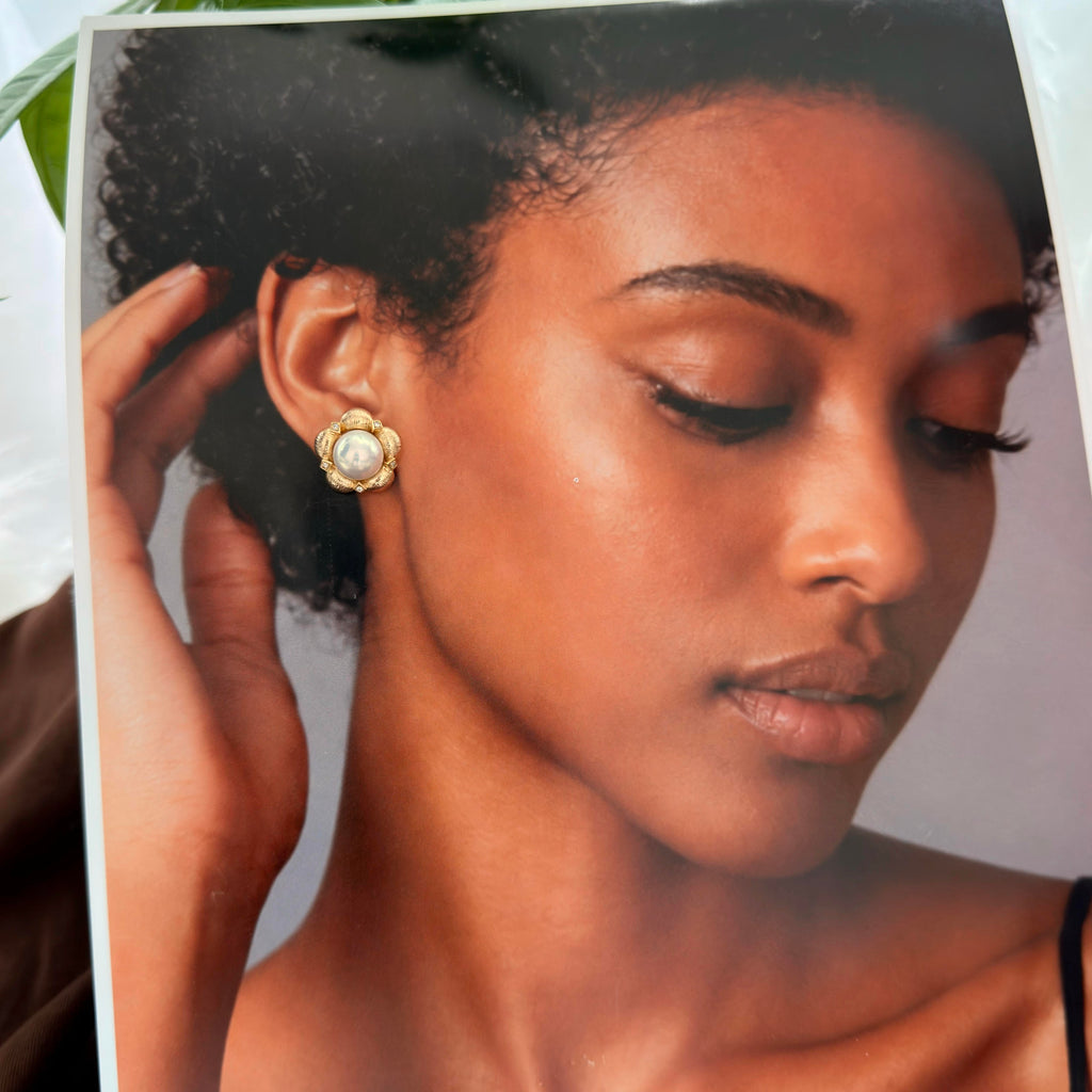 Bridal-style white pearl flower earrings in gold-plated silver.