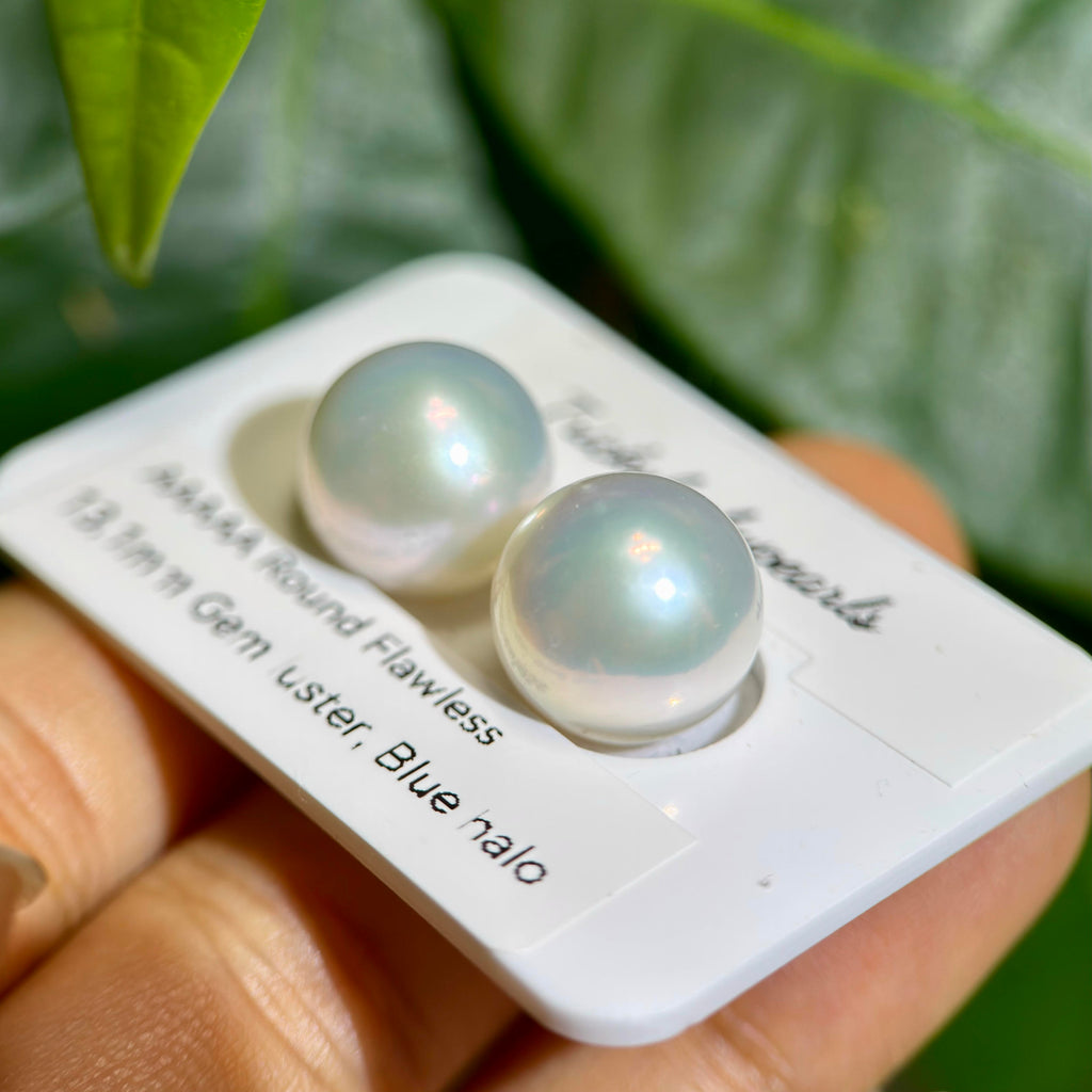 Blue halo pearl studs with luminous Aurora lustre.