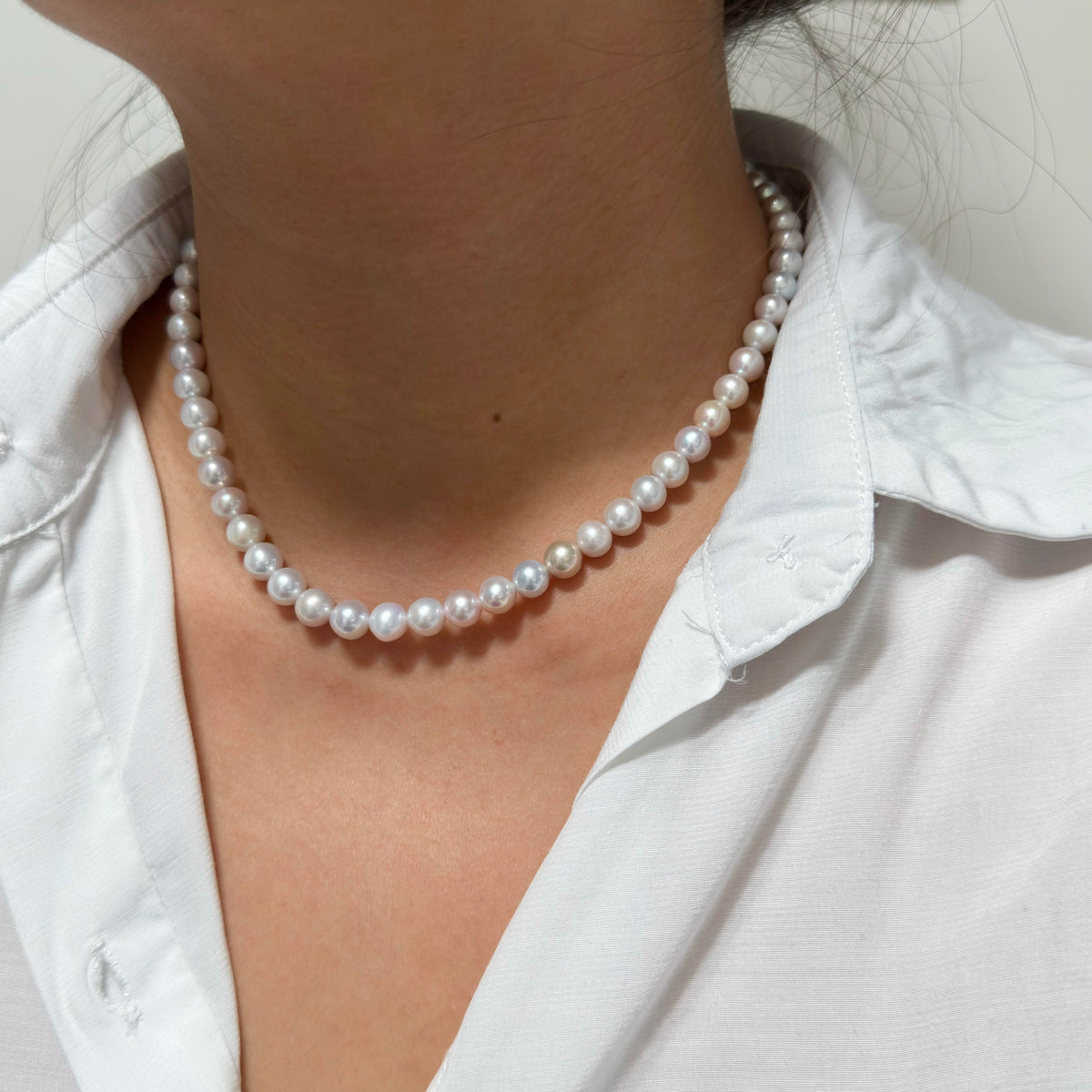 Classic single-strand freshwater pearl necklace in white base with mixed pastel colours.