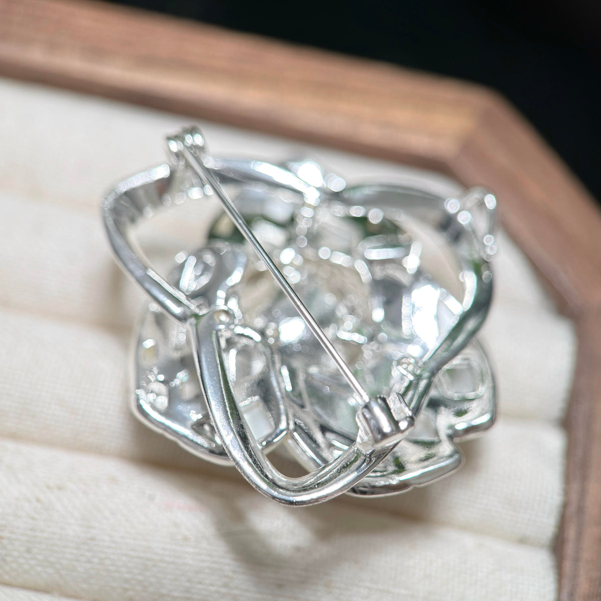 Back view of freshwater pearl camellia brooch showing the pin clasp closure.