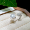 White pearl ring with sculptural sterling silver panther design.