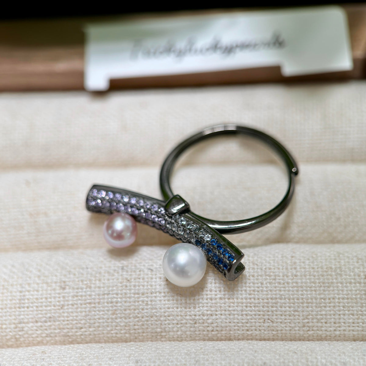 Sterling silver seesaw pearl ring with adjustable open band.