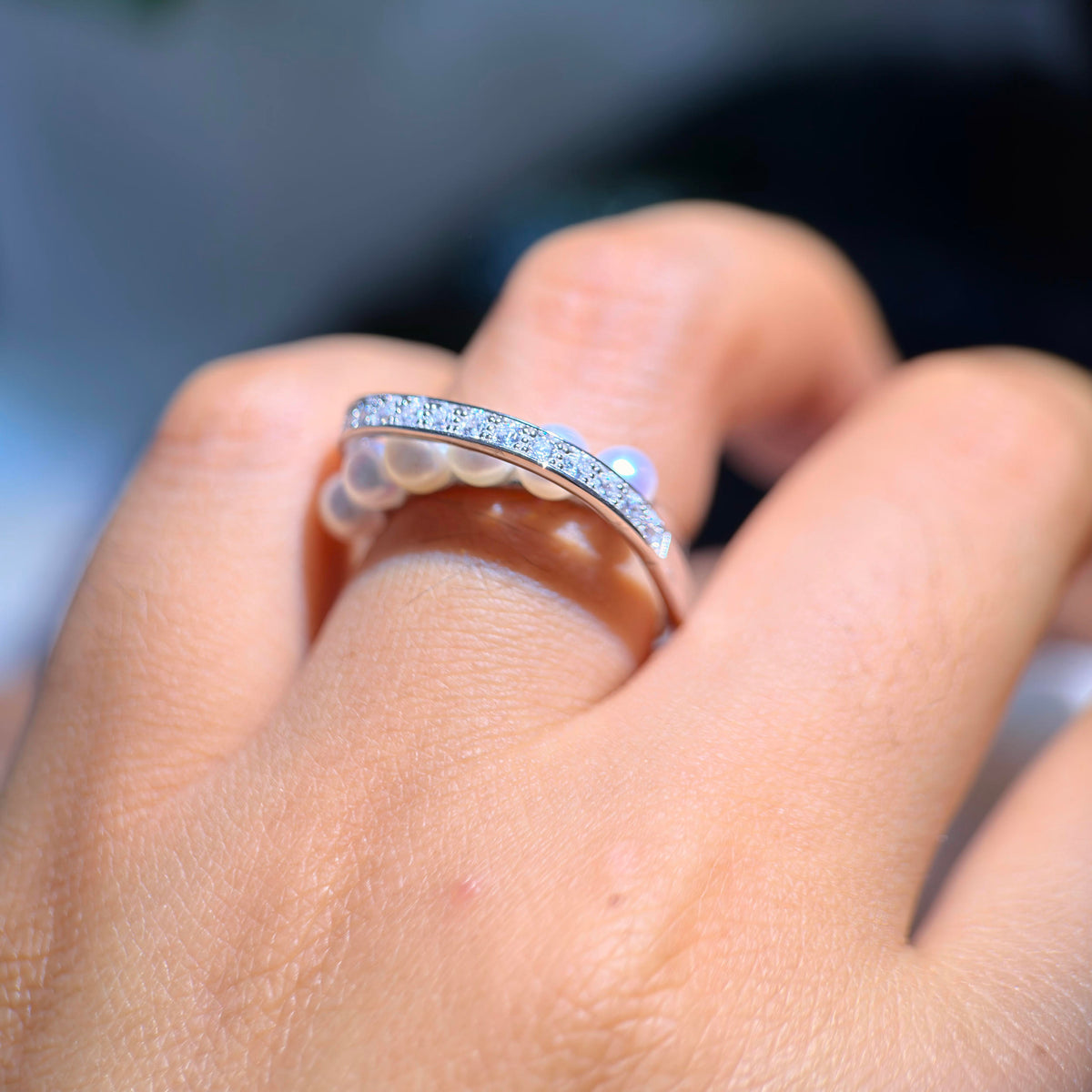 Unique adjustable ring with luminous white freshwater pearls.