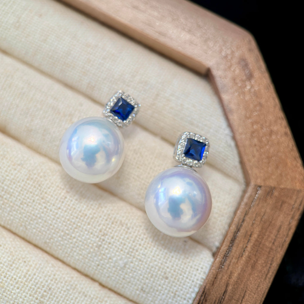 Royal blue sapphire-style stones paired with luminous freshwater pearls.

