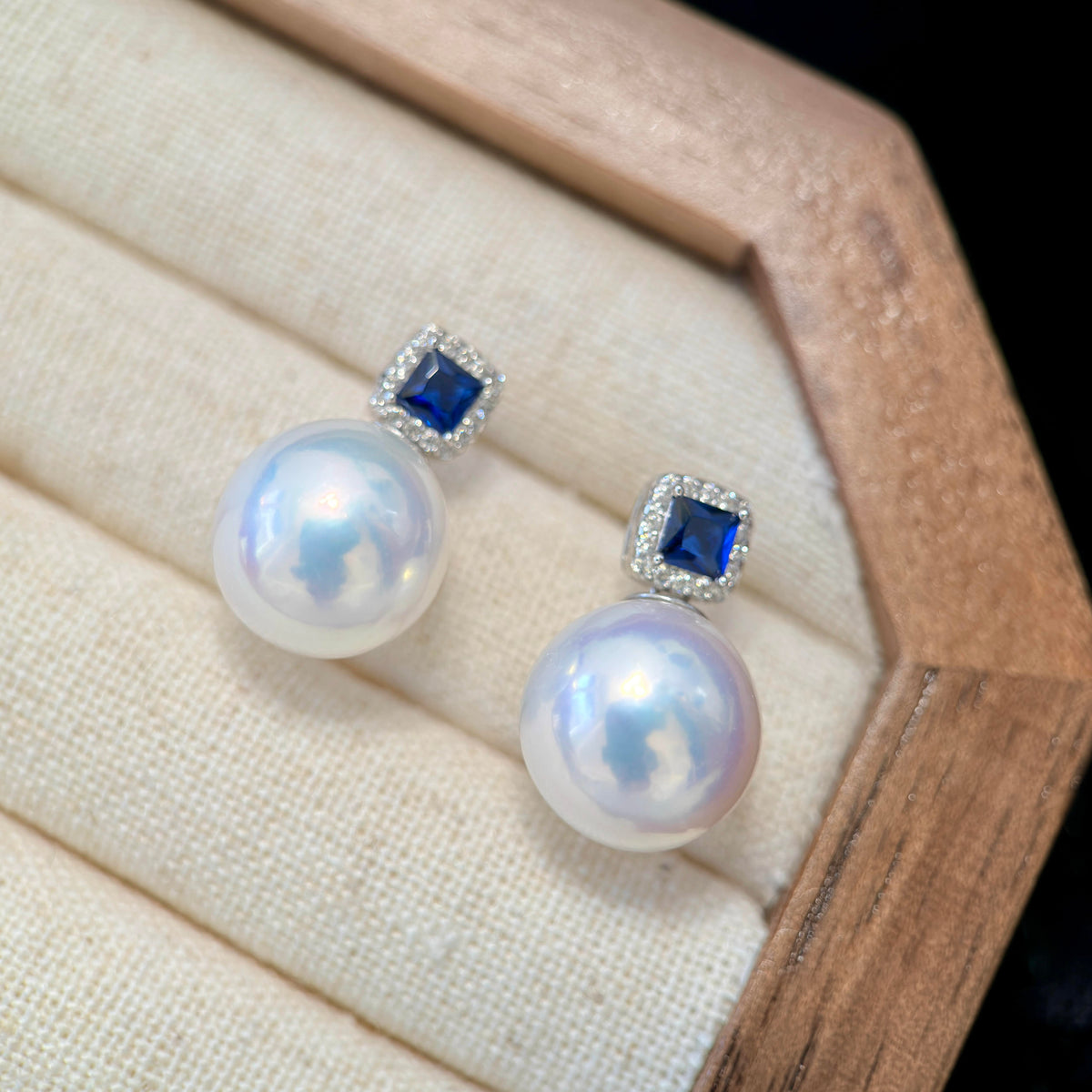 Royal blue sapphire-style stones paired with luminous freshwater pearls.
