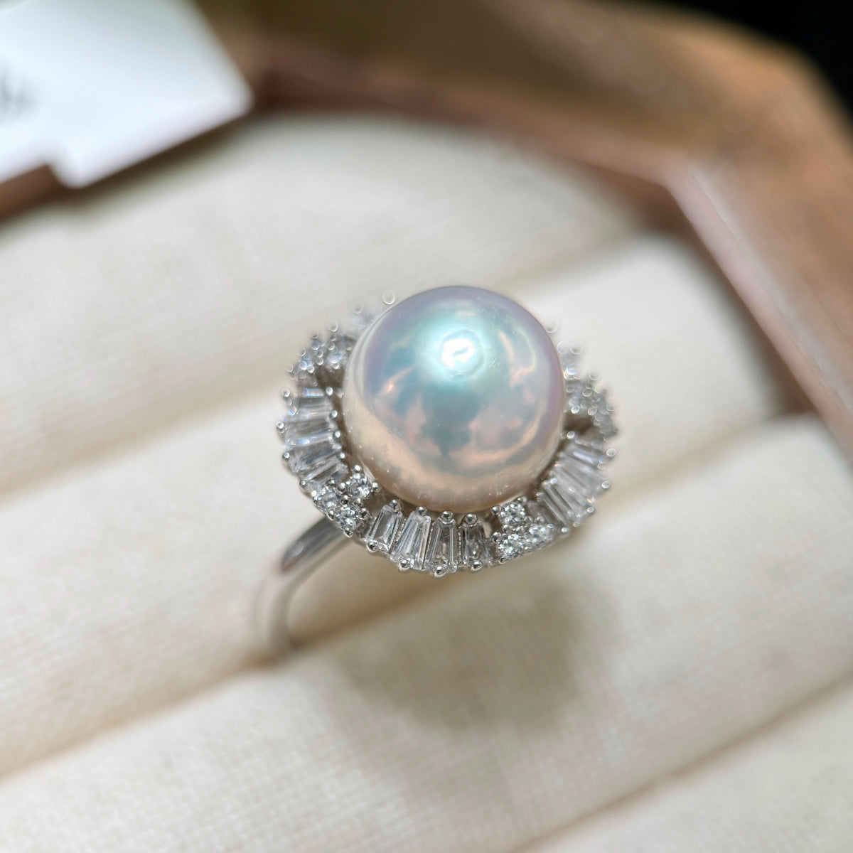 10.3 mm white freshwater pearl halo ring with gem-quality lustre.