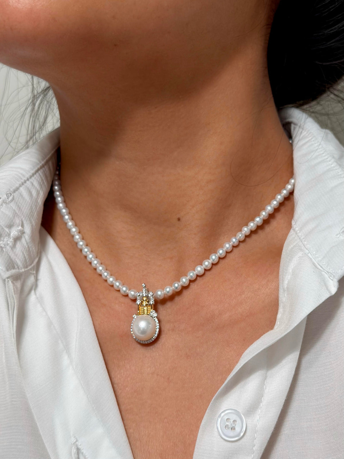 Whimsical castle necklace with a luminous natural freshwater pearl.