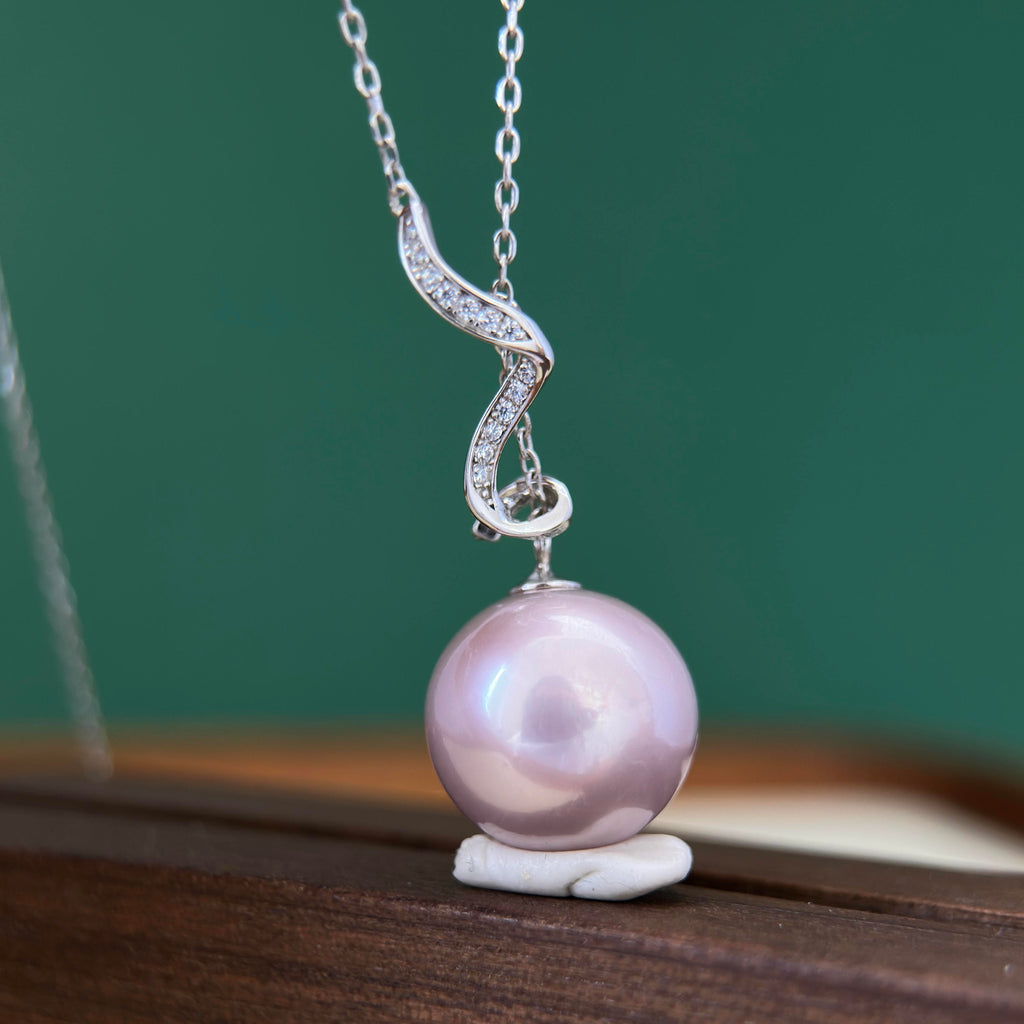 14.5 mm pale purple freshwater pearl necklace with sterling silver serpentine detail.