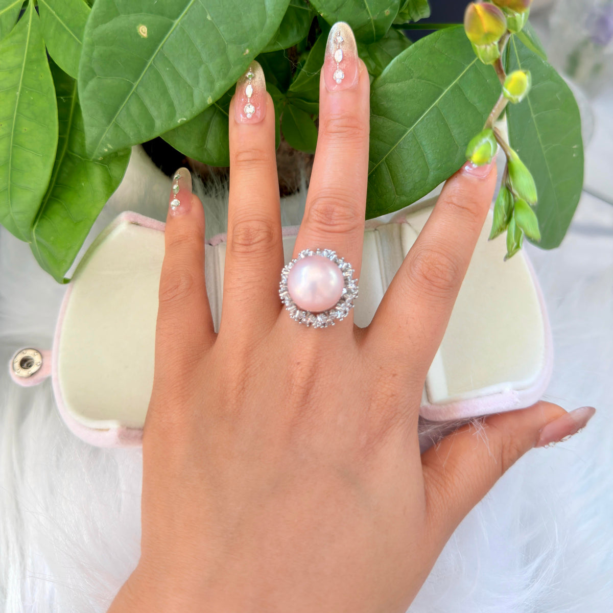 Romantic pink pearl statement ring with adjustable band.